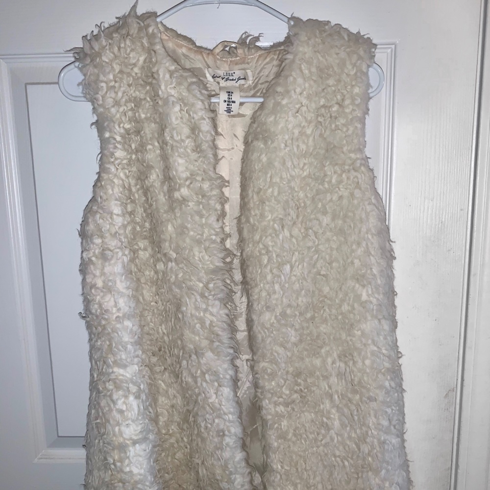 Cream colored fur vest